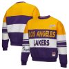 Mitchell & Admirable Ness x DANNIJO Los Angeles Lakers Women's Gold/Purple Blocked Pullover Sweatshirt Act fast! Only a handful left. Secure this amazing jersey now.
